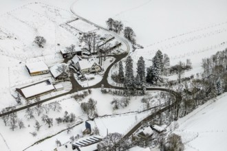 Aerial view of the winter landscape in Mosebolle with riding stable near Meschede in winter with