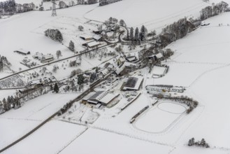 Aerial view of the winter landscape in Mosebolle with riding stable near Meschede in winter with