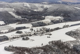 Aerial view of the winter landscape in Mosebolle with riding stable near Meschede in winter with