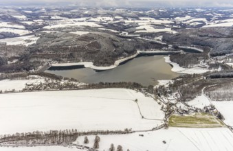 Aerial view of the Hennesee at low water near Meschede in winter with snow in the Sauerland in