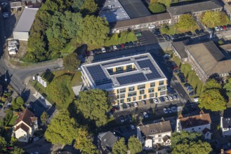 Aerial view, new building with solar roof of the company headquarters of the Heitkamp Group on the