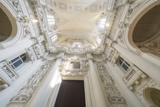 View of the richly decorated ceiling of a baroque church with architectural details, Munich,