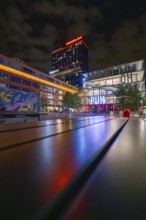 Urban scenery at night with vivid neon lights and modern architecture, urban flair, Munich, Germany