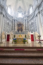 Magnificently decorated church altar in baroque architecture with sculptures and lavish