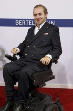 Samuel Koch arriving at the Bertelsmann Summer Party 2025 at the Bertelsmann Representative Office