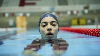Turkish Paralympic champion swimmer Sevlay Öztürk trains in a swimming pool in Gaziantep, Türkiye,