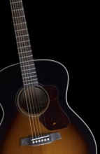 Detail of a acoustic guitar in black back