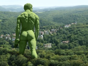 Green giant walking in rural ambiance, seen from behind