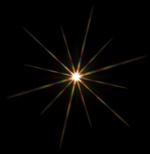 Colorful flashy spotlight star made with optical star filter on camera