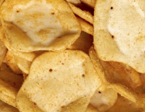 Full frame closeupof some baked crisp salty snack pieces