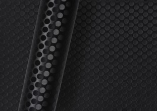 Rolled dark round dotted surface over same full frame textured background