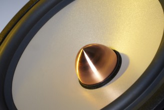 A yellow illuminated loudspeaker detail
