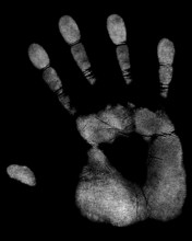 A white handprint of a right hand in black back