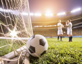 AI generated image showing a goal netting closeup and football in stadium ambiance