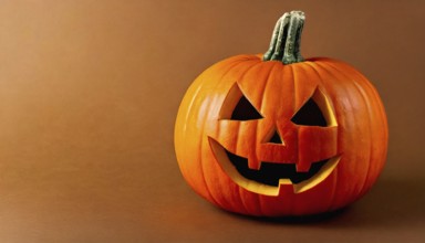 AI generated image showing a illuminated halloween pumpkin in orange back with shadow