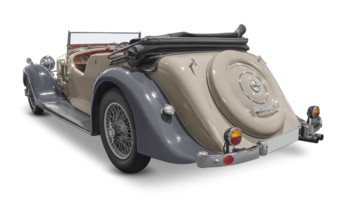 Rear view of a classic car isolated in white back with shadow