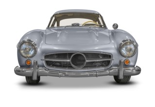 Frontal shot of a silver colored historic vehicle coupe in white back with shadow