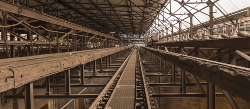 Weathered rusty industrial scenery with old rundown, steel girders and appliances