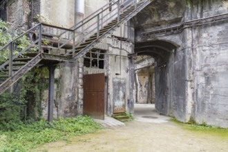 Rotten industrial architectural scenery including a rundown stairway