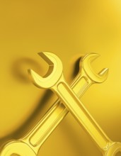 AI generated image showing crossed golden wrenches in golden ambiance