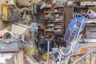 A messy garage detail filled with various things