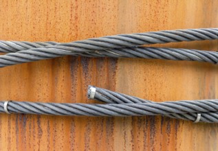 Closeup shot of wire ropes on rusty ground