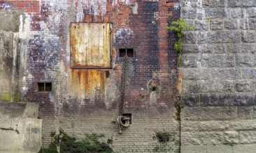 Rundown weathered quai wall seen at the Port of Hamburg