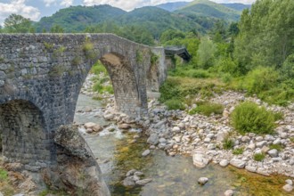 Historic stone bridge at the Ardeche river in southern France