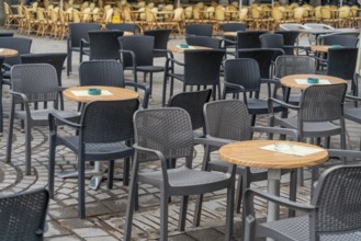 Outdoor scenery with tables and chairs seen in Normandy, France