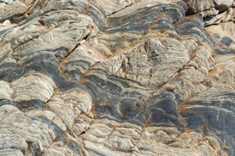 Full frame abstract stone structure detail seen at a rocky coast in Brittany, France