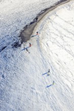 Aerial view, pedestrians, sledges and skis in the snow at the Mottbruchhalde, Brauck, Gladbeck,