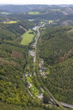 Aerial view, forest area and Rummenohler Straße with railway line in the valley at the river Volme