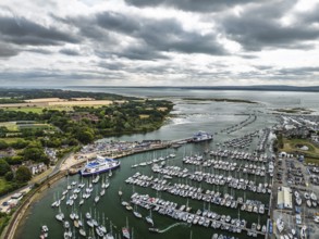 Wight Light car ferry to Isle of Wight on Lymington River and marina from drone, Lymington, New
