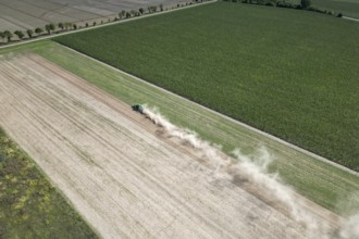 Field work, tractor, ploughing, cultivating, sowing peas, fertilising, dryness, drought,