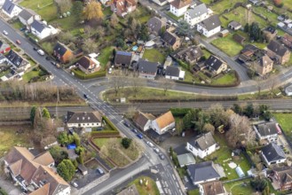 Aerial view railway crossing Wiescherhöfener Straße and waiting cars in Hamm, Ruhr area, North