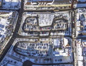 Aerial view, car park Santa-Monica-Platz, location former synagogue, parked cars in the snow,