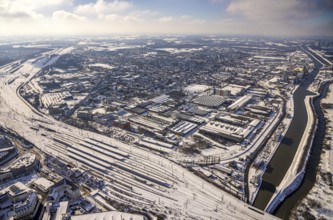 Aerial view, Hamm main station, tracks and platforms in the snow, industrial area at the harbour,