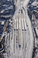 Aerial view, Hamm main station, tracks and platforms in the snow, winter, centre, Hamm, Ruhr area,