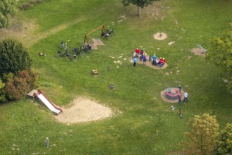Aerial view, cyclists resting on a playground meadow on Brehmstraße in the Rhynern district of