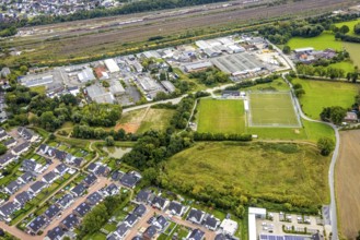 Aerial view, commercial area Schieferstraße and fallow land at the sports facility TuS Germania