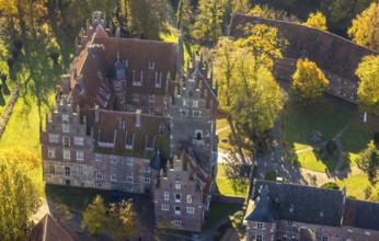 Aerial view, Heessen Castle with public school and boarding school in the autumnal forest in the