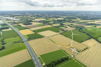 Aerial view, meadows and fields with construction site and new wind turbine, Rhynern, Hamm, Ruhr