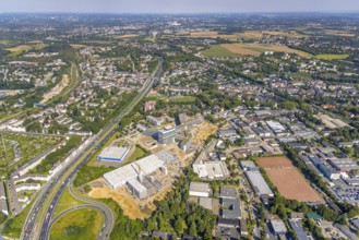 Aerial view, construction site and new construction ALDI-Nord Campus on the A40 motorway, Am