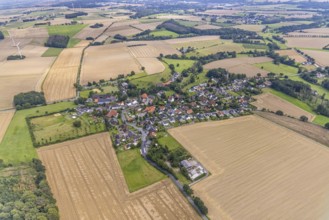 Aerial view, village view with protestant village church at the cemetery and catholic church St.