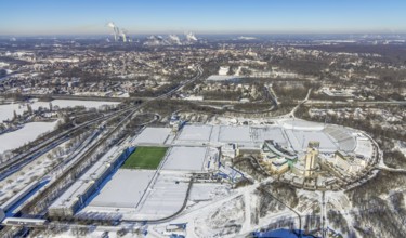 Aerial view, training ground and park stadium in the snow at the Veltins-Arena, Hotel Courtyard by