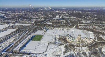 Aerial view, training ground and park stadium in the snow at the Veltins-Arena, Hotel Courtyard by