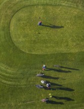 Aerial view, golf course golf club Schloss Horst and golf player on the green in the district Horst