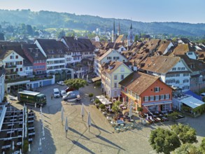 Old town with the Landsgemeindeplatz surrounded by street cafés and restaurants, behind the