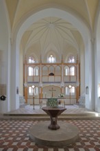 Baptismal font and chancel, interior view of the neo-Gothic St Peter's Church, UNESCO,