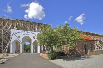 Portal to the spa gardens through the graduation tower, entrance, archway, inscription, Tolberg,